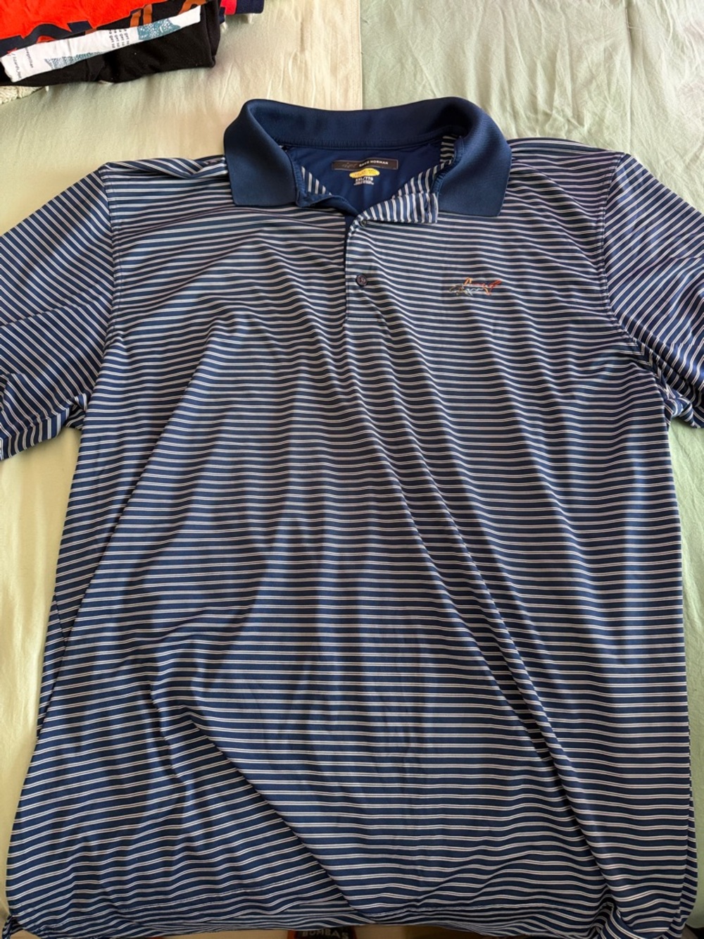 Greg Norman Collection Navy and Light Blue Striped Polo